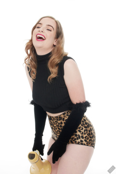 Harriet in black stretchy top and retro-style animal-print control-briefs worn as hotpants