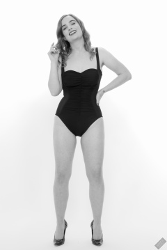Harriet models vintage Carol Wior tummy-control one-piece swimsuit