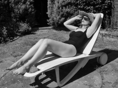 Harriet models vintage Carol Wior tummy-control one-piece swimsuit