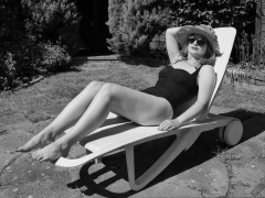 Harriet models vintage Carol Wior tummy-control one-piece swimsuit