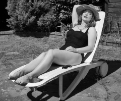 Harriet models vintage Carol Wior tummy-control one-piece swimsuit