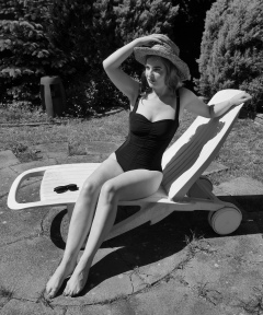 Harriet models vintage Carol Wior tummy-control one-piece swimsuit