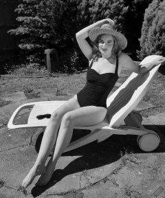 Harriet models vintage Carol Wior tummy-control one-piece swimsuit