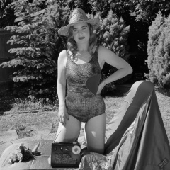 Harriet in golden retro  "Half Moon" tummy control swimsuit