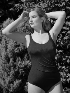 Harriet enjoys the sunshine in blue vintage one-piece swimsuit