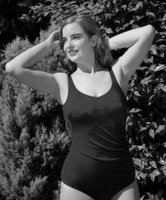 Harriet enjoys the sunshine in blue vintage one-piece swimsuit