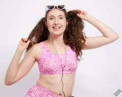 Estella Rose as Skater Girl - posing in psychedelic pink two piece sportswear