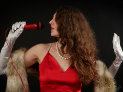 Estella Rose poses in her own red evening dress