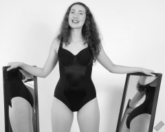 Estella Roses poses in her own tight black bodyshaper