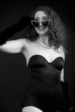 Estella Rose models black strapless Miraclesuit shapewear