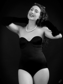 Estella Rose models black strapless Miraclesuit shapewear