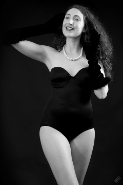 Estella Rose models black strapless Miraclesuit shapewear