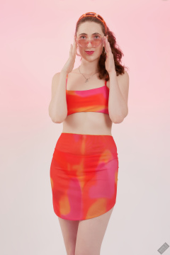 2025-06-14 Estella Rose models her own brightly coloured bikini ensemble