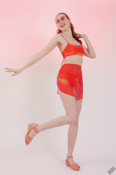 2025-06-14 Estella Rose models her own brightly coloured bikini ensemble