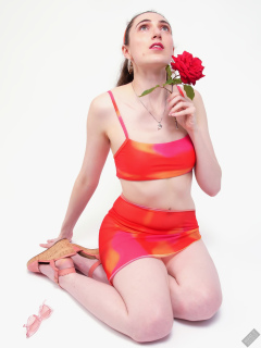 2025-06-14 Estella Rose models her own brightly coloured bikini ensemble