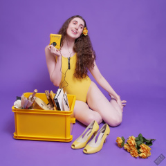 2025-06-14 Mellow Yellow set. Estella Rose models yellow one-piece sports swimsuit and a box load of other yellow sporty stuff