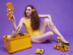 2025-06-14 Mellow Yellow set. Estella Rose models yellow one-piece sports swimsuit and a box load of other yellow sporty stuff