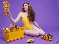 2025-06-14 Mellow Yellow set. Estella Rose models yellow one-piece sports swimsuit and a box load of other yellow sporty stuff