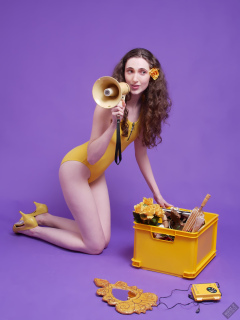 2025-06-14 Mellow Yellow set. Estella Rose models yellow one-piece sports swimsuit and a box load of other yellow sporty stuff