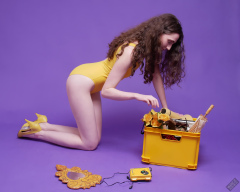 2025-06-14 Mellow Yellow set. Estella Rose models yellow one-piece sports swimsuit and a box load of other yellow sporty stuff