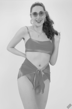 2025-06-14 Estella Rose models her own brightly coloured bikini ensemble