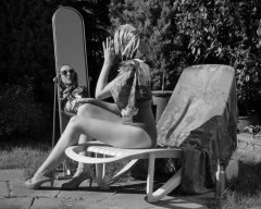 Estella Rose in purple swimsuit exercising in the garden