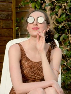 2026-08-01 Estella Rose models copper coloured Half Moon swimsuit.
