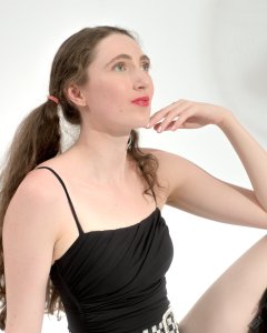 2026-08-01 Estella Rose models black one-piece swimsuit and accessories..