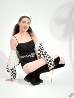 2026-08-01 Estella Rose models black one-piece swimsuit and accessories..