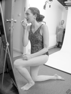 2026-08-01 Estella Rose models vintage animal-print one-piece swimsuit.