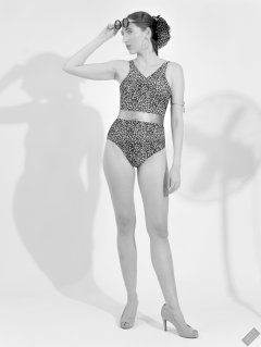 2026-08-01 Estella Rose models vintage animal-print one-piece swimsuit.