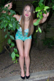 Josie Lauren in the garden wearing tight-fitting vintage Berlei corselette