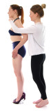 Shoulders back, chin parallel to the floor. Lora and Amy demonstrate their grandmother's posture and figure control exercises