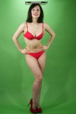Olive Cartley modelling red love bikini, while performing her deportment exercises