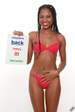 Caleann models simple red sixties-style belted bikini