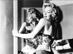 influences: Marilyn Monroe being laced into corset