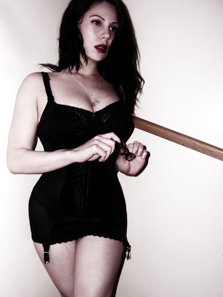 Modern girl wearing black all-in-one girdle