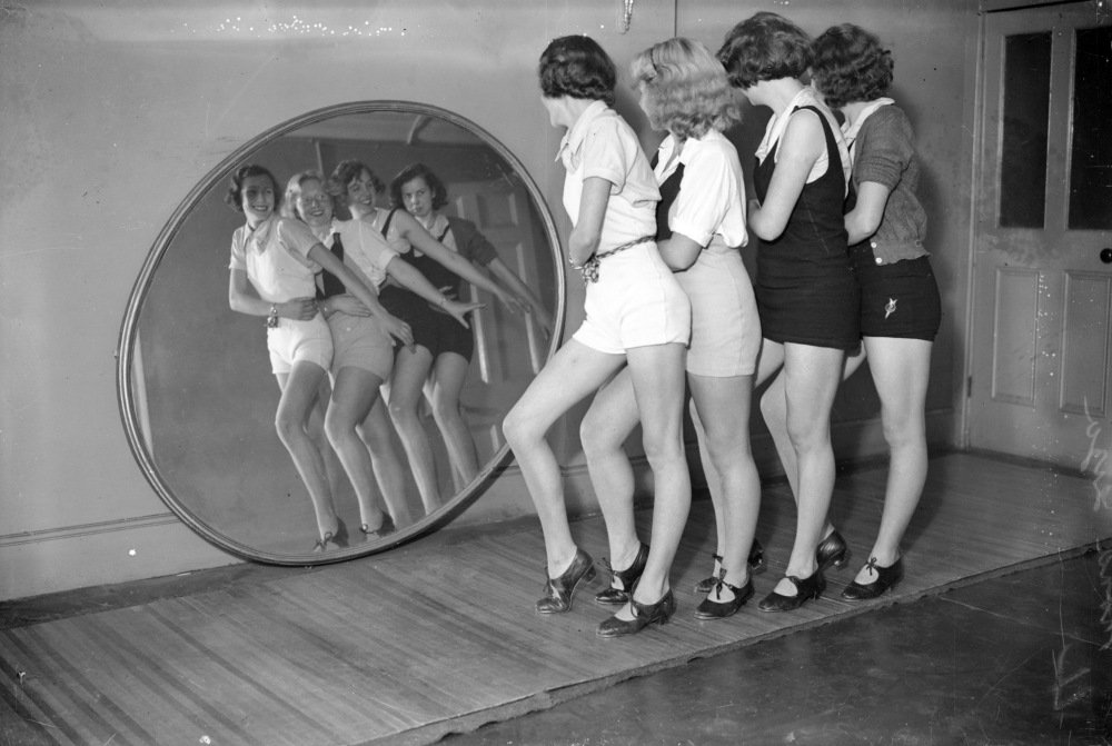 Dancers in front of mirror