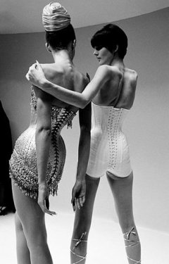 Unknown model wearing tightly-laced corset outfits