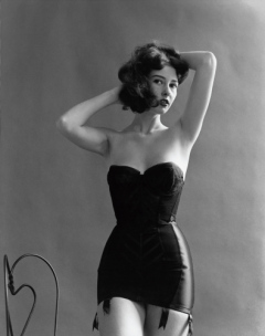 Unknown model in strapless bra and girdle by Ronny Jaques