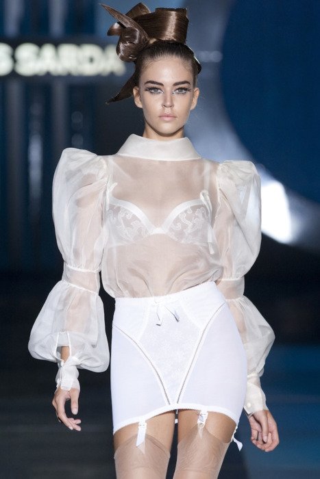 Unknown model wearing lace top and white roll-on girdle